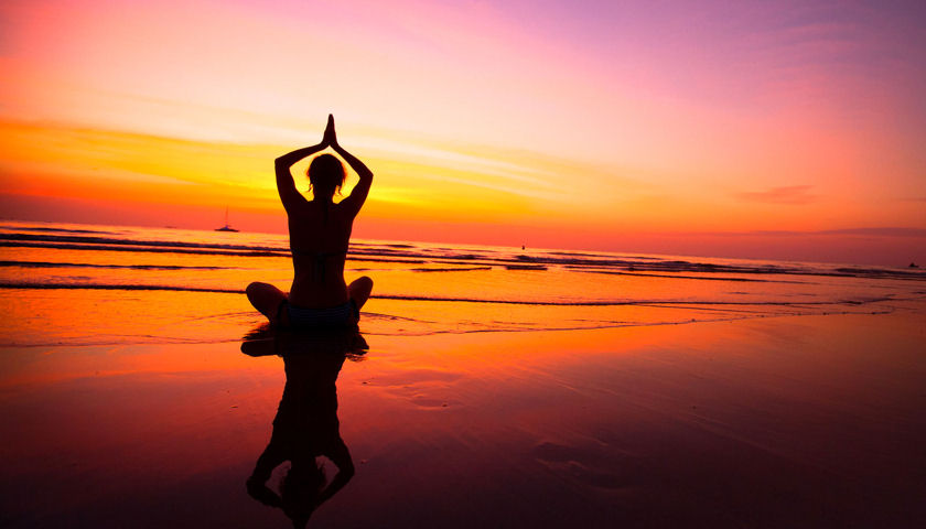 yoga on the beach sunset